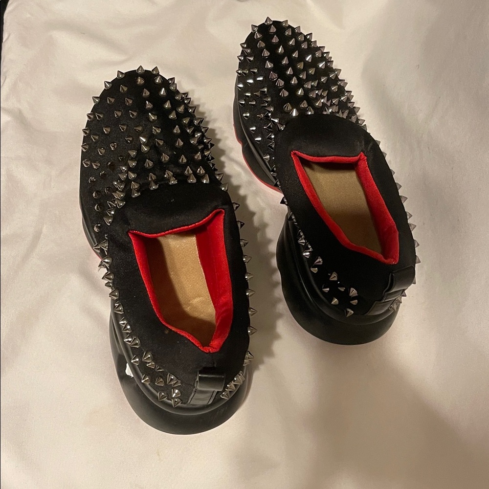 Christian Louboutin black  Spiked Slip-On Shoes with Red Interior. Size 9